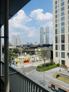 a view from a balcony of a city with buildings at WillsChengduCenter in Chengdu