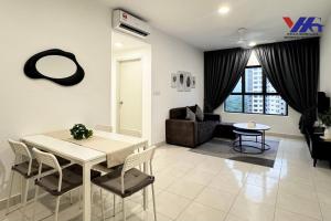 a living room with a table and a couch at Arena Suite with Netflix KLIA in Sepang