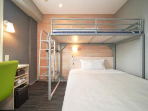 Postel nebo postele na pokoji v ubytování Super Hotel Kofu Showa Inter