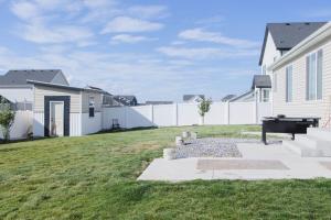 a backyard with a pool table and a fence at TSDLS Hometel in Smithfield