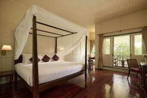 Kalanan Riverside Resort客房内的一张或多张床位