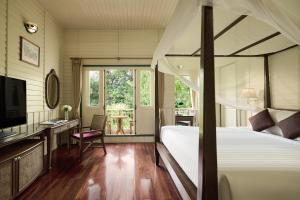 Kalanan Riverside Resort客房内的一张或多张床位