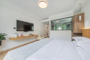 เตียงในห้องที่ 安吉季意民宿 Jiyi Boutique Homestay, Anji, Huzhou