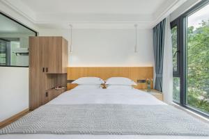 เตียงในห้องที่ 安吉季意民宿 Jiyi Boutique Homestay, Anji, Huzhou