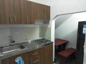 Kuchyň nebo kuchyňský kout v ubytování Hermosas habitaciones super ubicadas