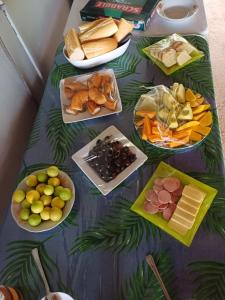 a table with different types of food on it at Pitake Lodge 1 in Nuku Hiva