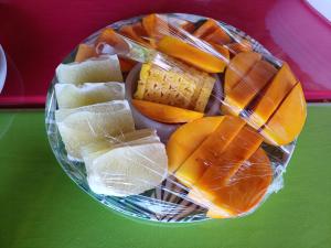 a bowl of fruit and vegetables on a table at Pitake Lodge 1 in Nuku Hiva