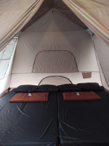 Postel nebo postele na pokoji v ubytování corak alam glamping