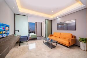 Posezení v ubytování Cloudy international apartment Beijing Rd A-mall