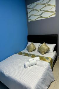 Postel nebo postele na pokoji v ubytování Hotel 3Winz, Chow Kit Hospital Kuala Lumpur