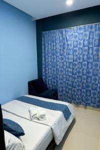Postel nebo postele na pokoji v ubytování Hotel 3Winz, Chow Kit Hospital Kuala Lumpur