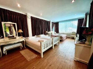 Voodi või voodid majutusasutuse Vongdeuan Resort toas