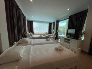 Voodi või voodid majutusasutuse Vongdeuan Resort toas