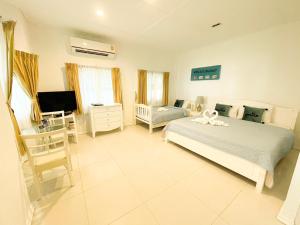 Voodi või voodid majutusasutuse Vongdeuan Resort toas