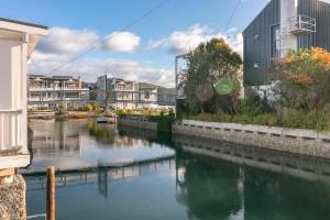 a body of water with houses and buildings at Turbine Villa in Knysna +33 photos