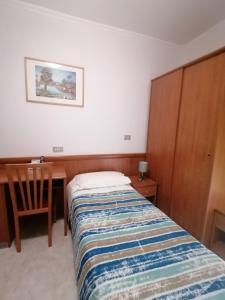 Postel nebo postele na pokoji v ubytování Albergo Ristorante Protti