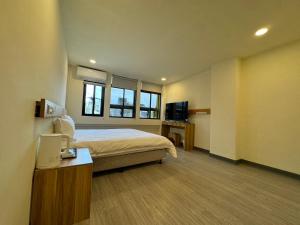 Postel nebo postele na pokoji v ubytování 慢且洄瀾文旅 Bantshiann Hualie Hotel
