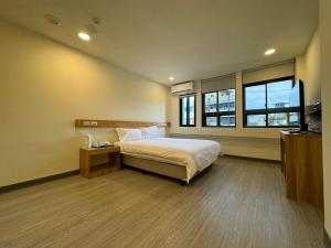 Postel nebo postele na pokoji v ubytování 慢且洄瀾文旅 Bantshiann Hualie Hotel