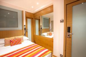 Postel nebo postele na pokoji v ubytování Hotel Bawa Continental