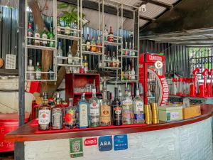 a bar with a lot of bottles of alcohol at Birdcage Boutique in Phnom Penh