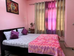 Postel nebo postele na pokoji v ubytování REMA HOMESTAY