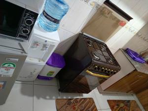an overhead view of a kitchen with an oven at Jayson Furnished Apartment, Nairobi in Nairobi