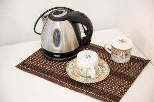 Příslušenství pro přípravu čaje a kávy v ubytování Casa Prati