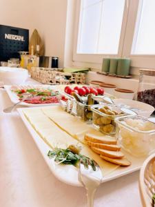 a table with several plates of food on it at Levendula Resort és Rendezvényközpont in Bogács