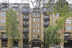 a large building with balconies on the side of it at Affordable Belltown Condo Near Space Needle & Downtown in Seattle