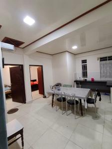 a dining room with a table and chairs in a room at SK Guest House in Shillong