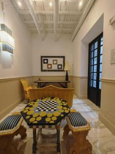 a living room with a table and a piano at Cozy Luxury Room Pantheon in Rome