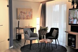 TV a/nebo společenská místnost v ubytování Privat & Boutique Hotel Plauer See
