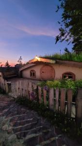 a house with a fence in front of it at Jashylkent House in Vorontsovskoye