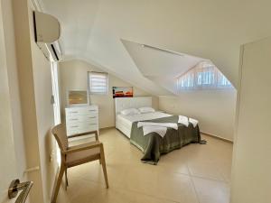 Ένα ή περισσότερα κρεβάτια σε δωμάτιο στο Villa Serenity By Luxury Group +51 φωτογραφίες