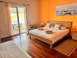 Postel nebo postele na pokoji v ubytování Boutique Hotel Tomić