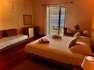 Postel nebo postele na pokoji v ubytování Boutique Hotel Tomić