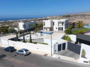 a house with a car parked in front of it at Paraiso House in Callao Salvaje +19 photos