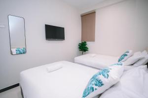 Postel nebo postele na pokoji v ubytování Swing & Pillows - Sunway Pyramid PJ