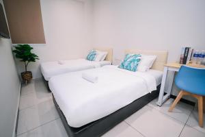 Postel nebo postele na pokoji v ubytování Swing & Pillows - Sunway Pyramid PJ