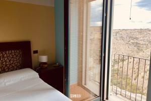 Postel nebo postele na pokoji v ubytování Luce nei Sassi Eleganza e Belvedere + 30 fotografií