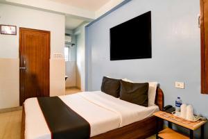 Postel nebo postele na pokoji v ubytování Super Hotel O New KOLKATA HOTEL