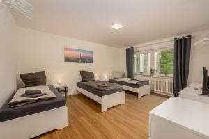 Postel nebo postele na pokoji v ubytování Business Apartments mit 1-2 Schlafzimmern in Lippstadt