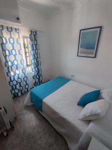 Postel nebo postele na pokoji v ubytování Casa Reyes Fataga