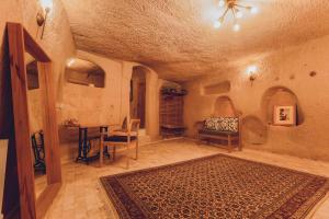 TV a/nebo společenská místnost v ubytování Pinhan Cave Suites