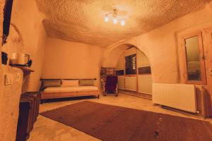Postel nebo postele na pokoji v ubytování Pinhan Cave Suites