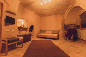 TV a/nebo společenská místnost v ubytování Pinhan Cave Suites