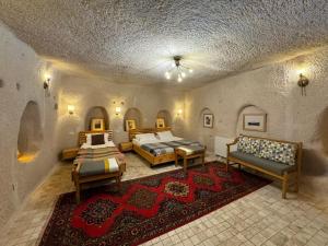 Postel nebo postele na pokoji v ubytování Pinhan Cave Suites