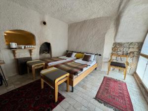 Postel nebo postele na pokoji v ubytování Pinhan Cave Suites
