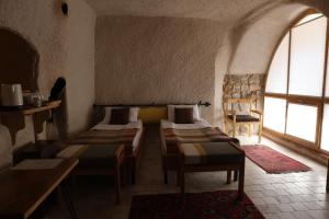 Postel nebo postele na pokoji v ubytování Pinhan Cave Suites