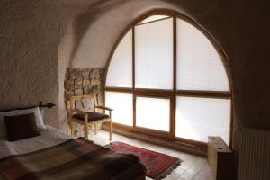 Postel nebo postele na pokoji v ubytování Pinhan Cave Suites